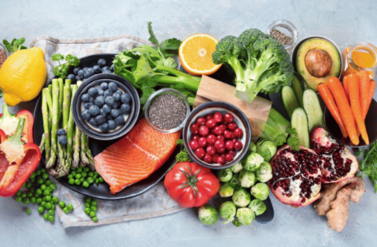 A complex spread of fruits, vegetables, and fish that help with eye health.